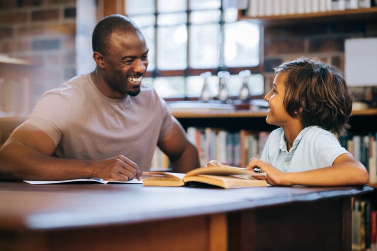 foster parent talking with foster kid in bookstore