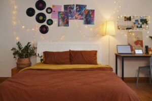 teenager's bedroom decorated with plans and music posters